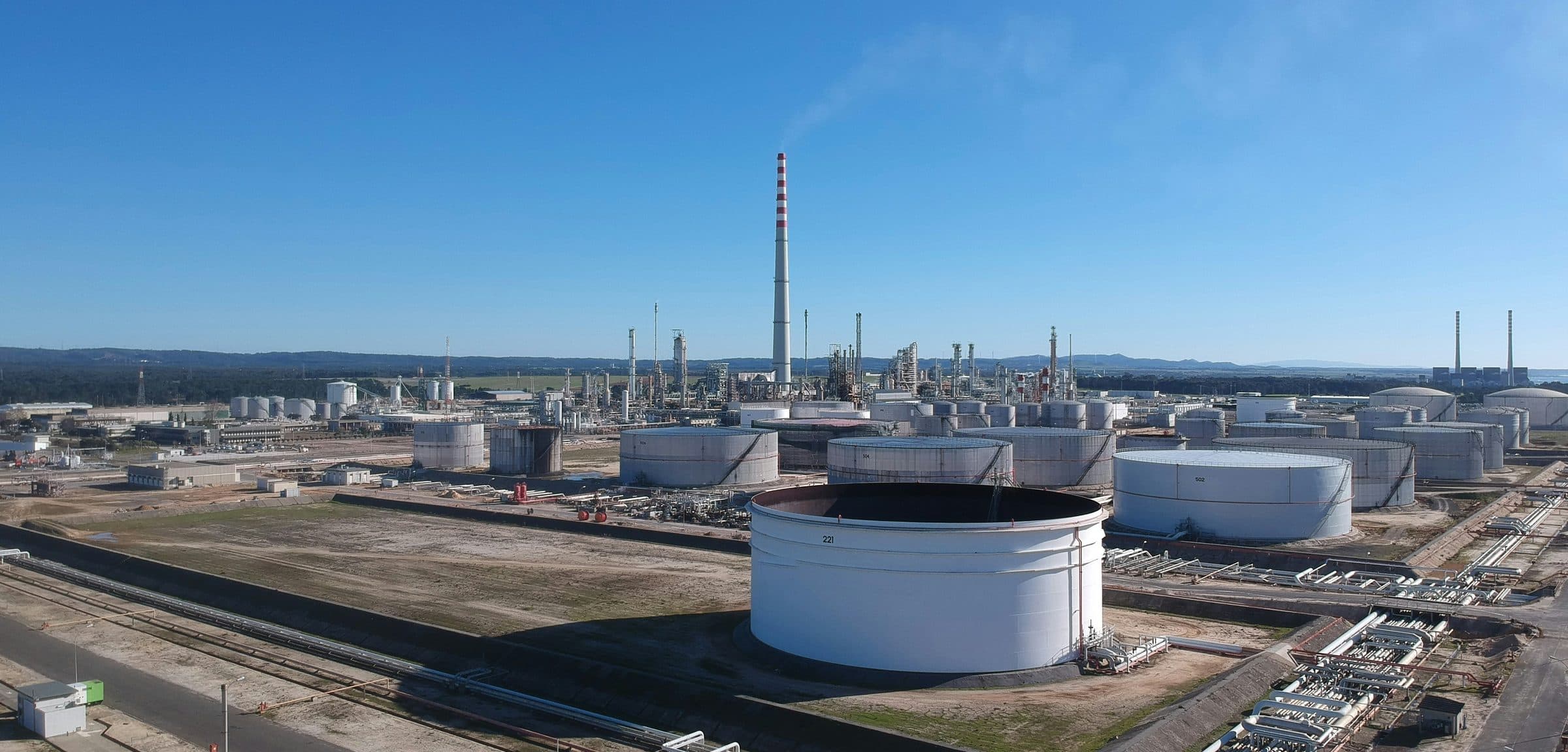 Aerial view of a storage tank farm and refinery.